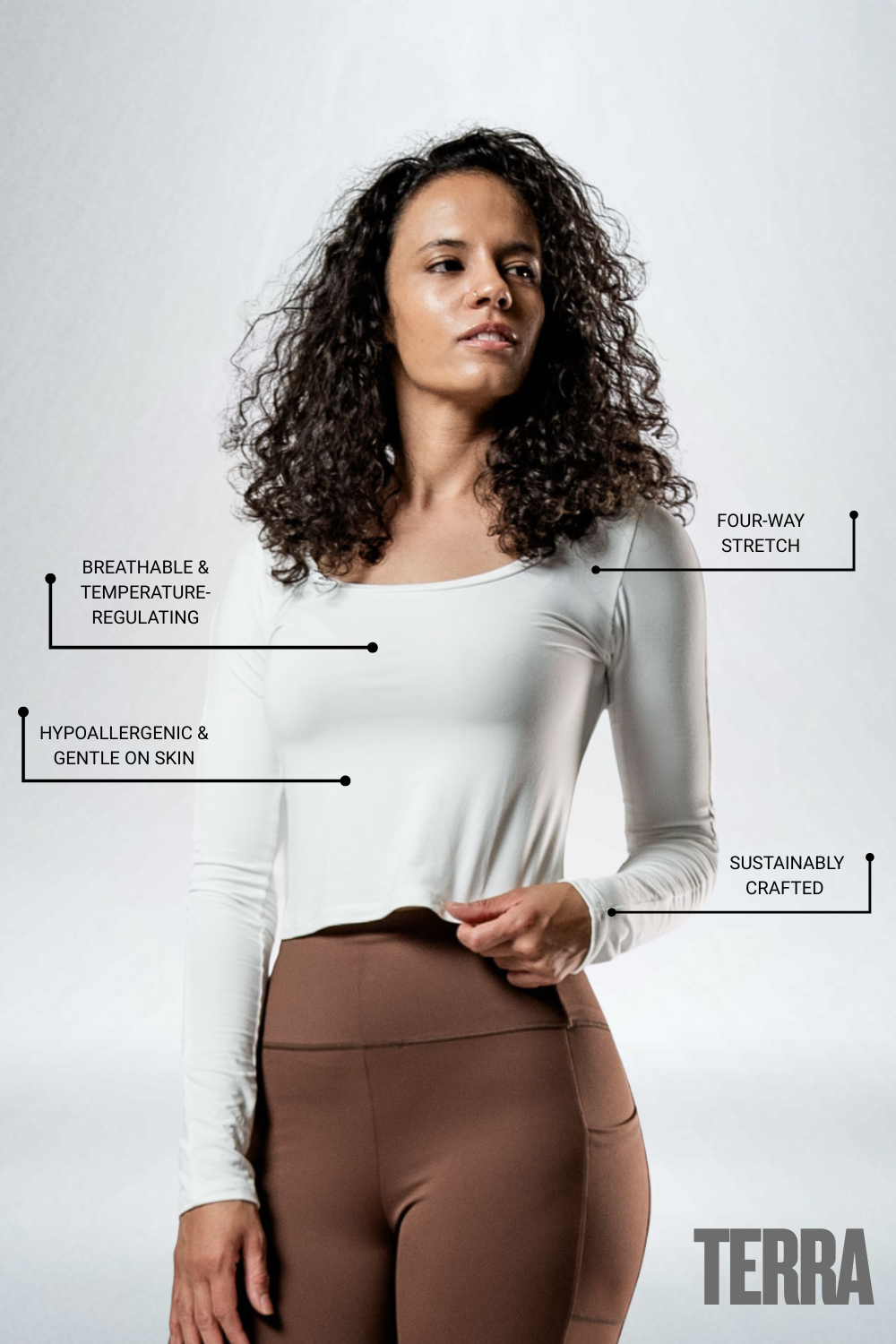 Women's white long sleeve crop T-shirt by Hot Trend Vault featuring a soft, comfortable fabric and a stylish arc design.