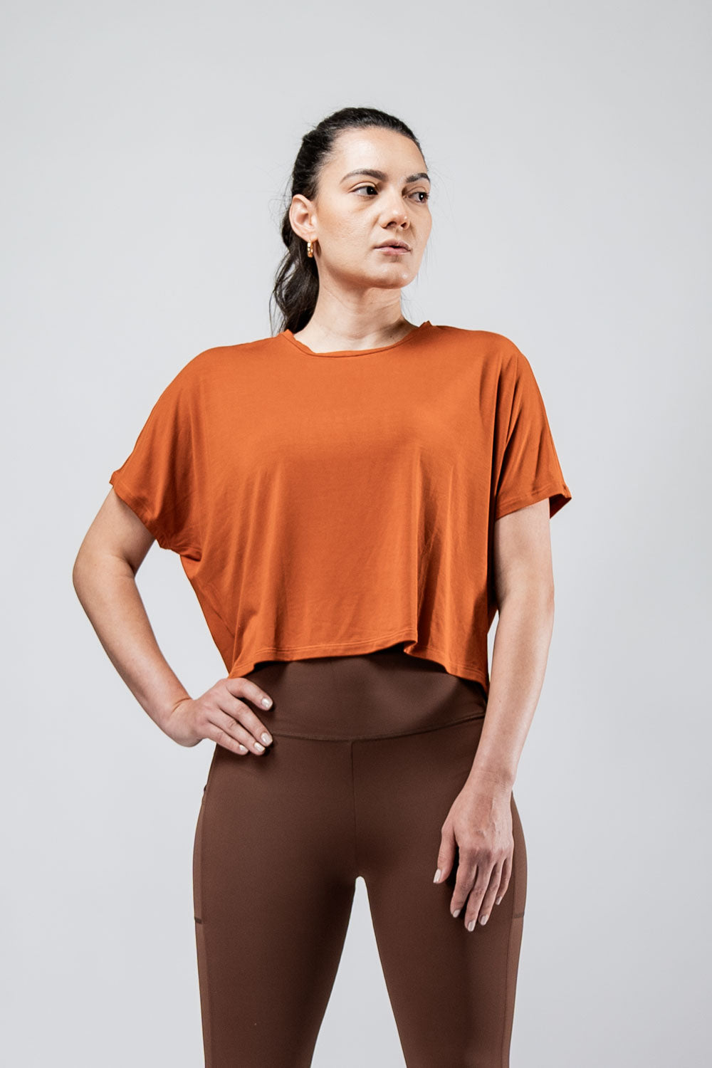 Women's Terra Recovery Drift Crop T-shirt in Sunfire Clay by Hot Trend Vault, featuring a relaxed silhouette and casual fit.