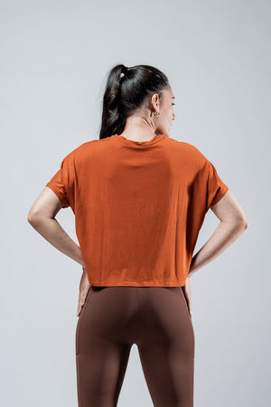 Women's Terra Recovery Drift Crop T-Shirt in Sunfire Clay color, relaxed fit by Hot Trend Vault, shown flat on a white background.