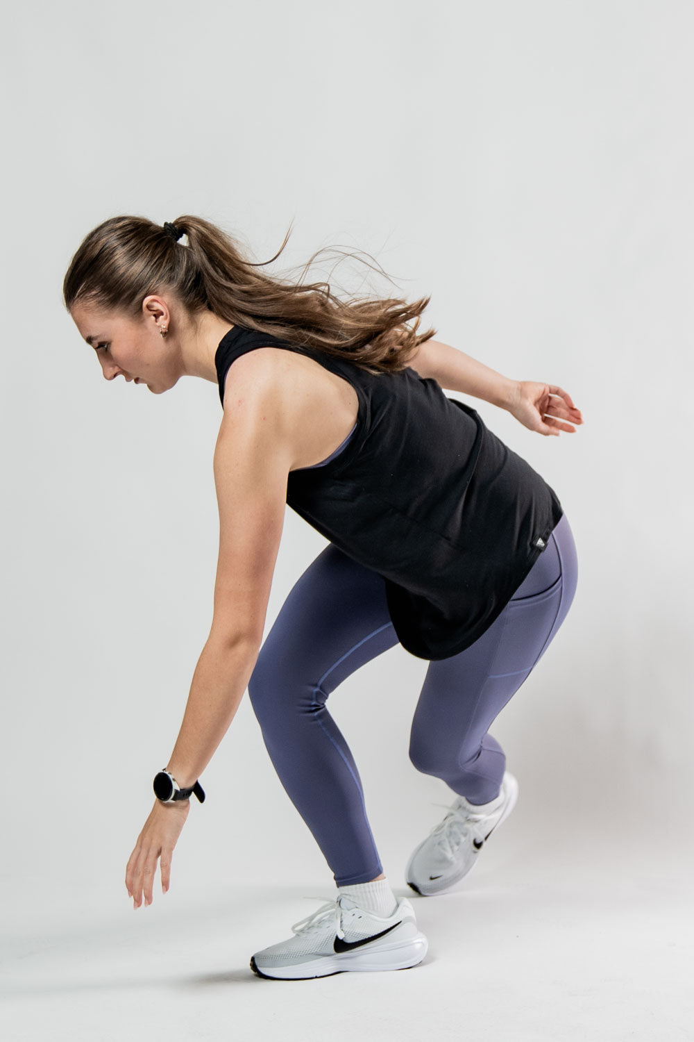 Women's black Terra Recovery Halo Tank top by Hot Trend Vault, a lightweight post-workout recovery tank for women.