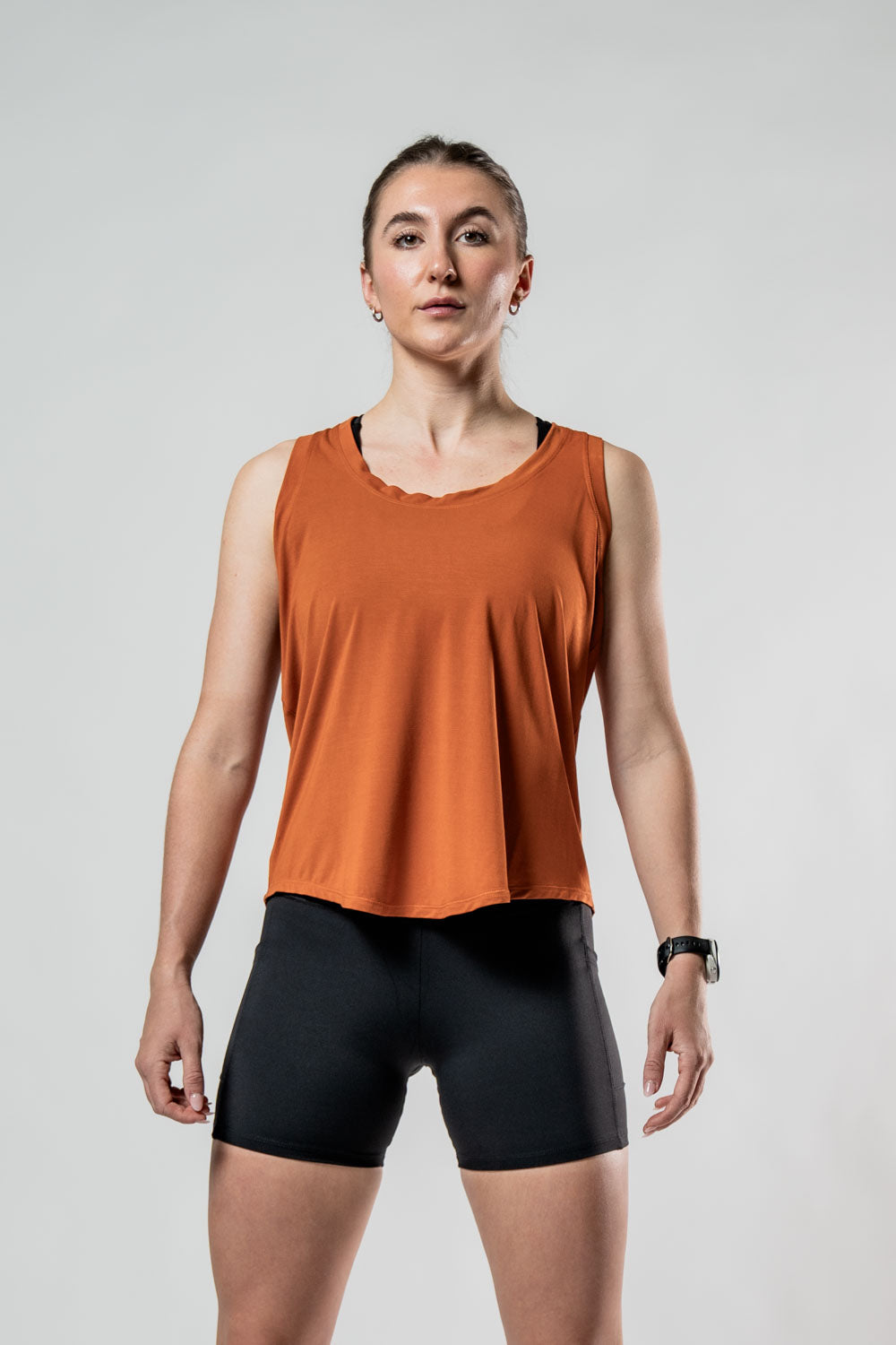 Women's Terra Halo Recovery Tank in Sunfire Clay by Hot Trend Vault, featuring a breathable, lightweight tank top design.