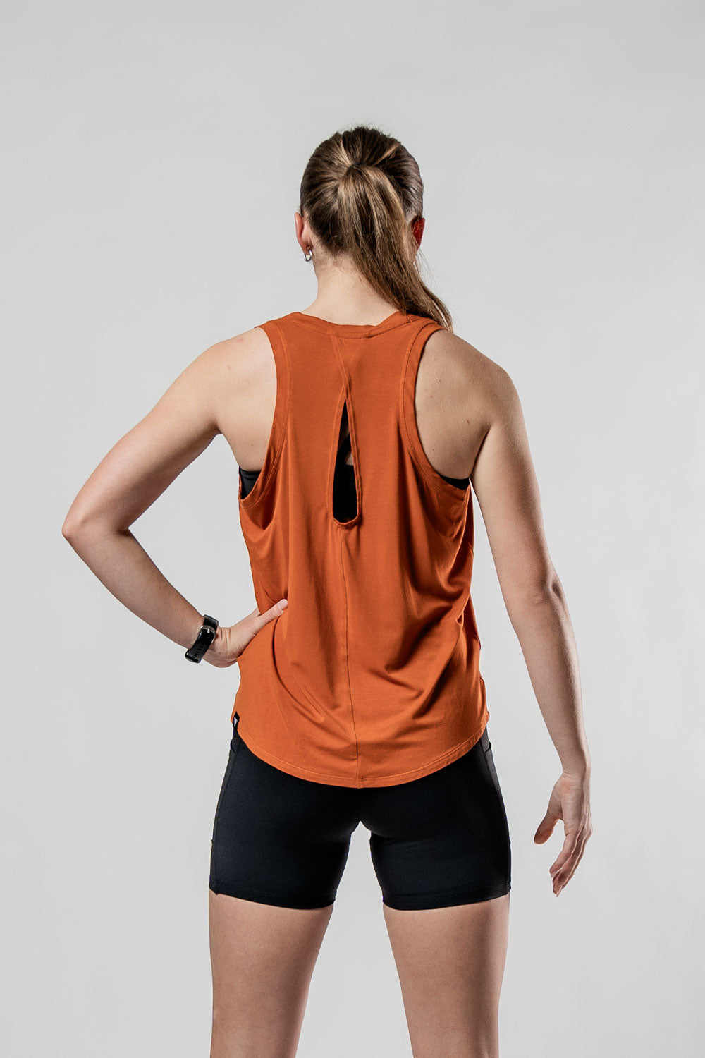 Women's Terra Halo Recovery Tank Top in Sunfire Clay by Hot Trend Vault, showing breathable fabric and sleeveless design.
