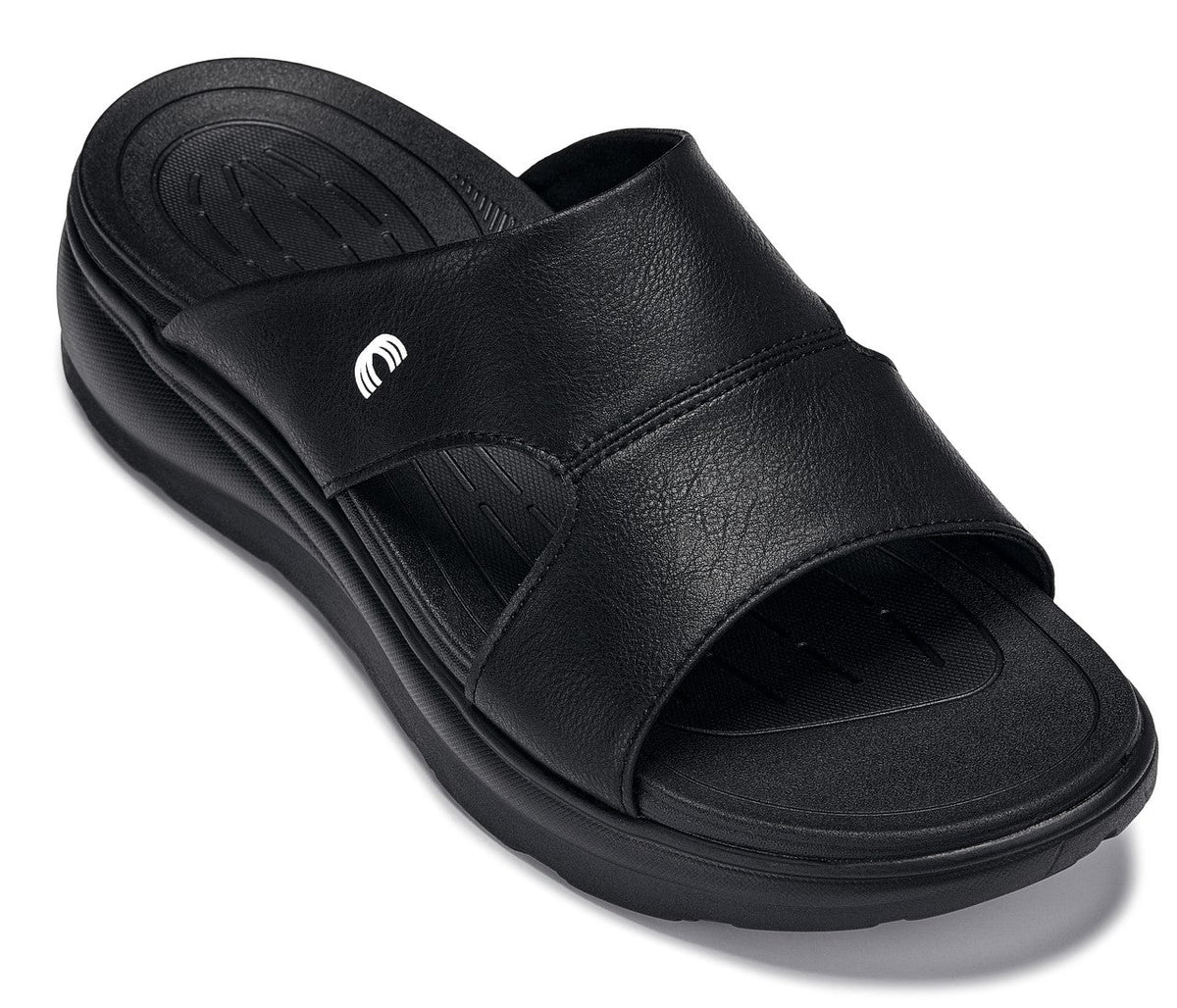 Black Calto X1655 height-increasing sandals by Hot Trend Vault with grainy finish and 2-inch lift for added height.