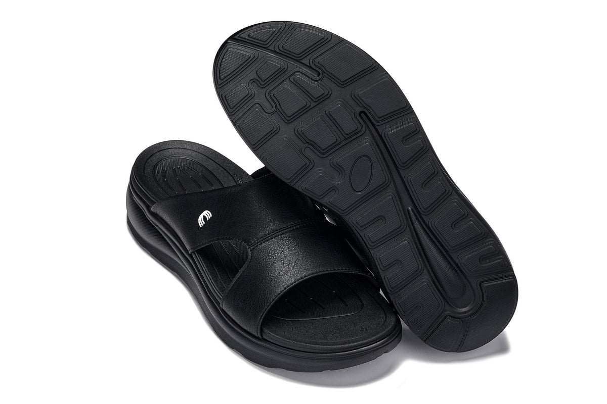 Black grainy Calto X1655 height-increasing sandals by Hot Trend Vault, showcasing their stylish design and elevated sole.