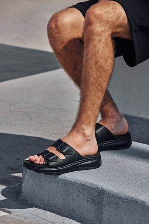 Black Calto X1660 sandals with dual buckles, 2 inches taller, featuring outdoor-ready design by Hot Trend Vault.