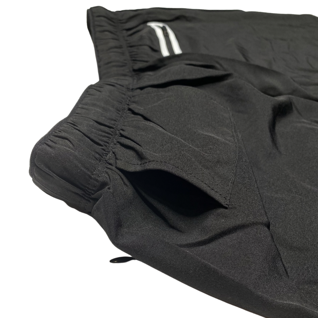 Black men's Pro Short with 5-inch inseam, compression fit, and zippered pockets from Hot Trend Vault activewear.