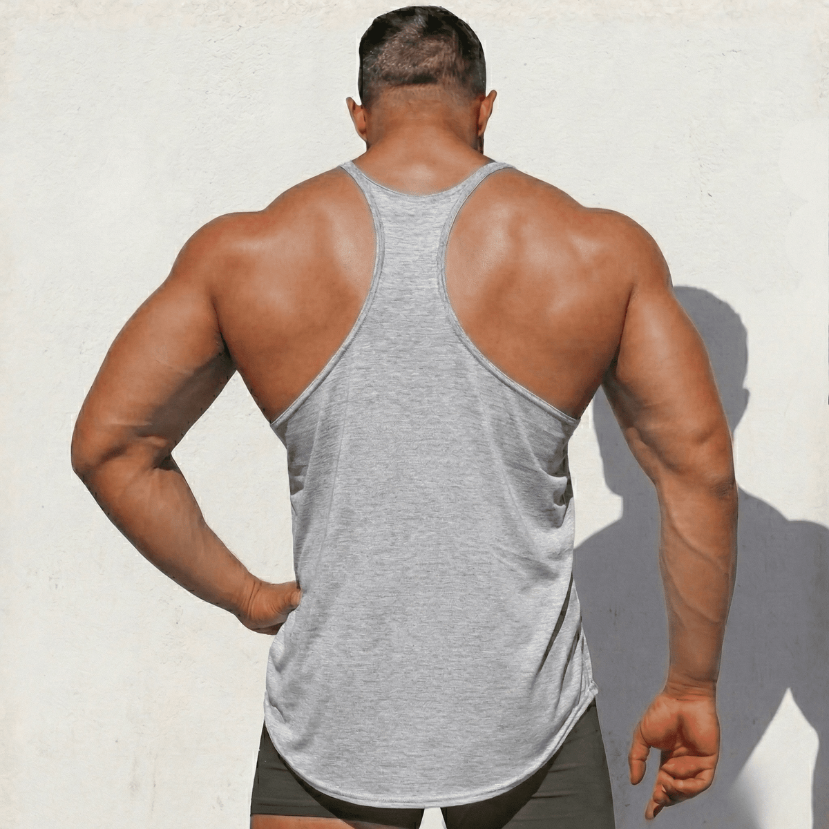 Black Original Stringer Tank Top by Physique Bodyware from Hot Trend Vault, made in the USA, displayed on a mannequin.