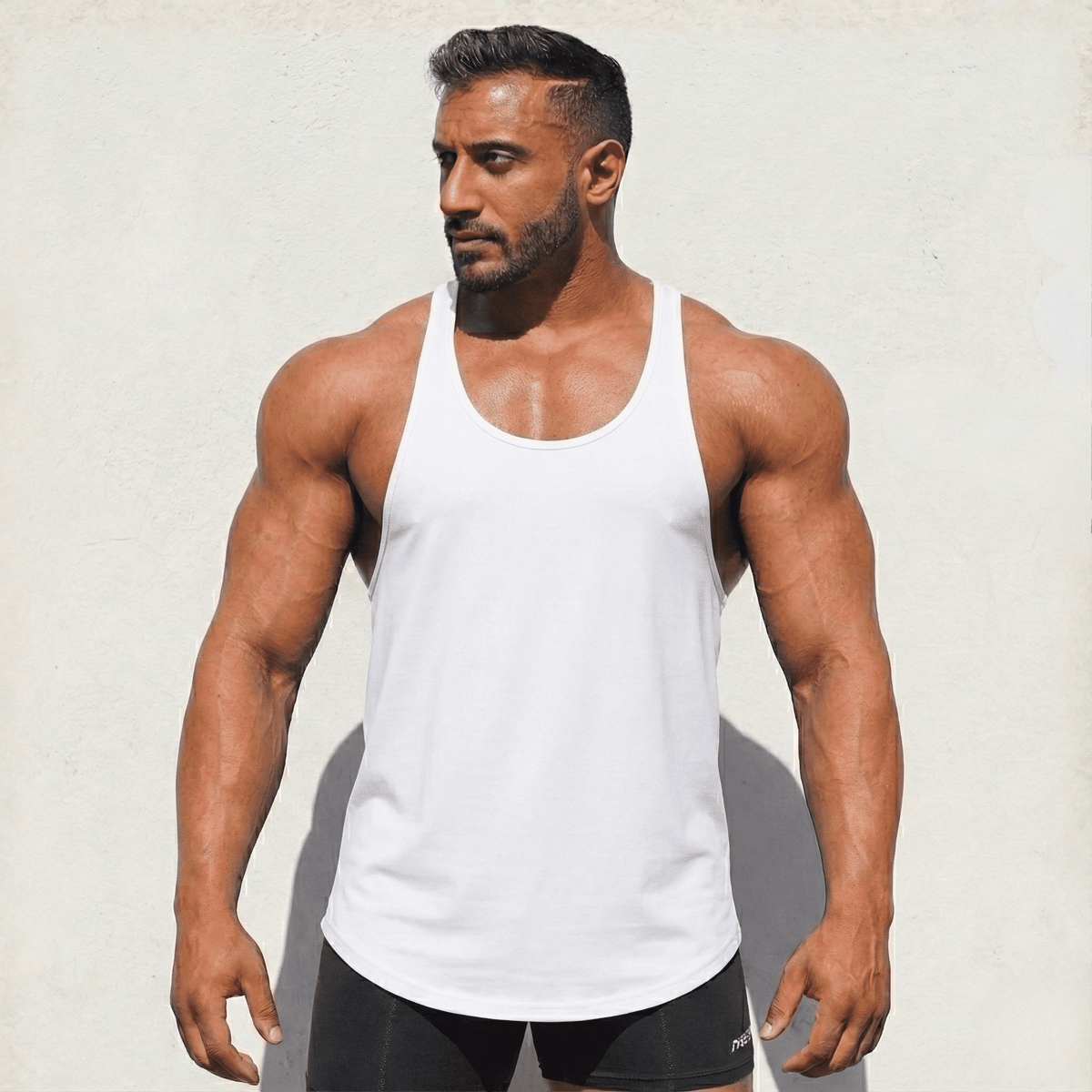 Black Original Stringer Tank Top by Physique Bodyware, made in the USA, featuring a fitted style and athletic design.