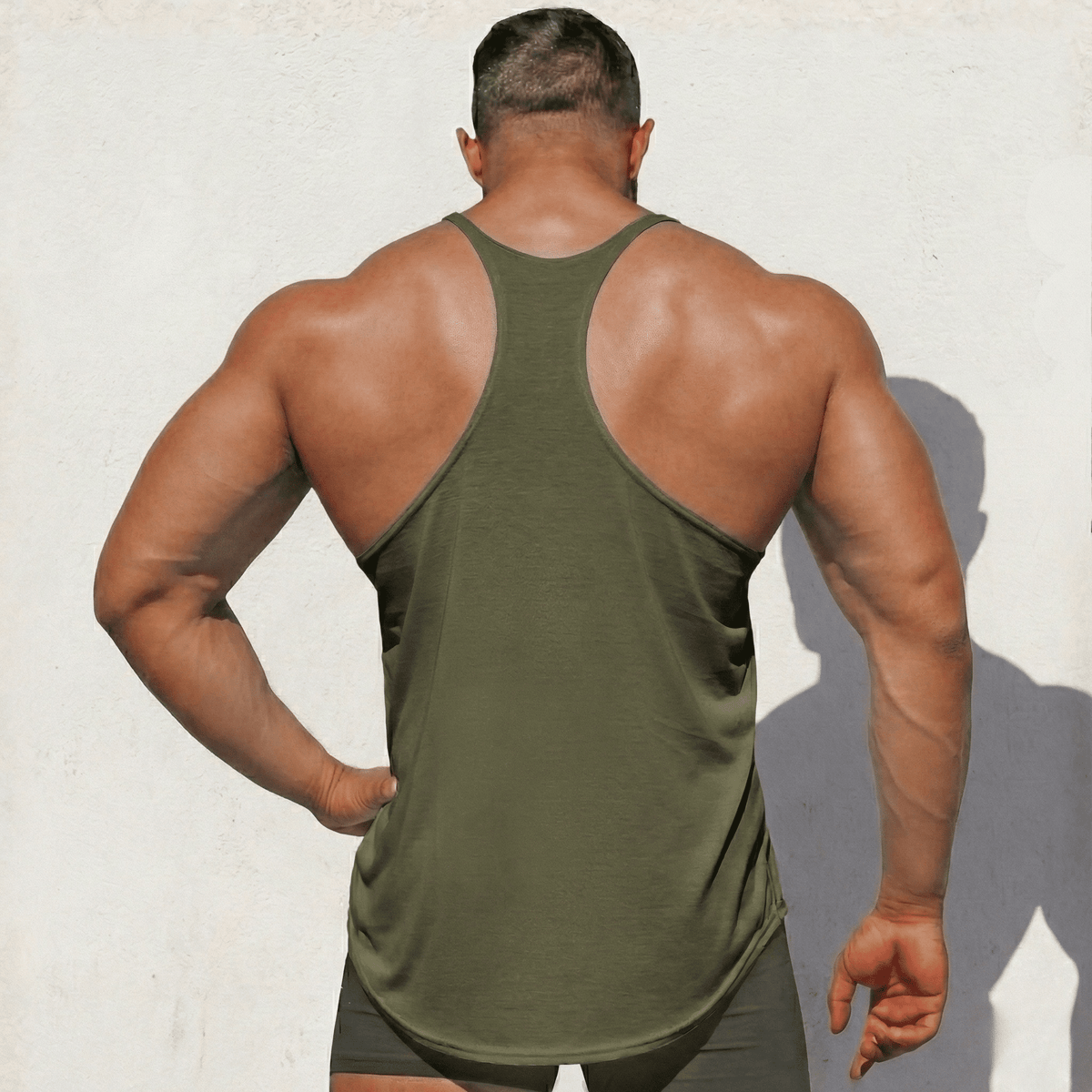 Hot Trend Vault original stringer tank top made in USA by Physique Bodyware, shown in black with sleeveless design and athletic fit.