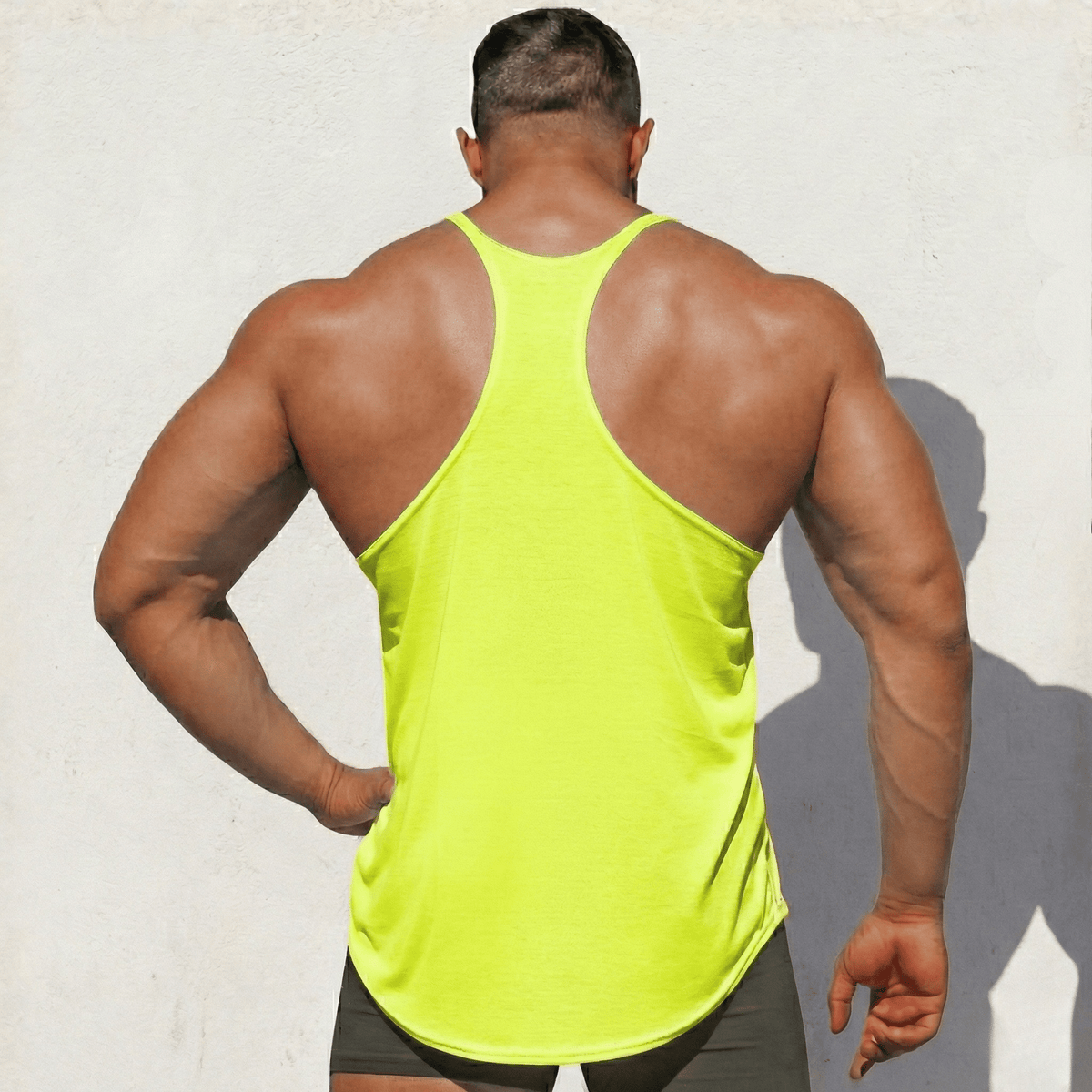 Black Original Stringer Tank Top by Physique Bodyware, made in the USA, featuring a sleeveless design and athletic fit.