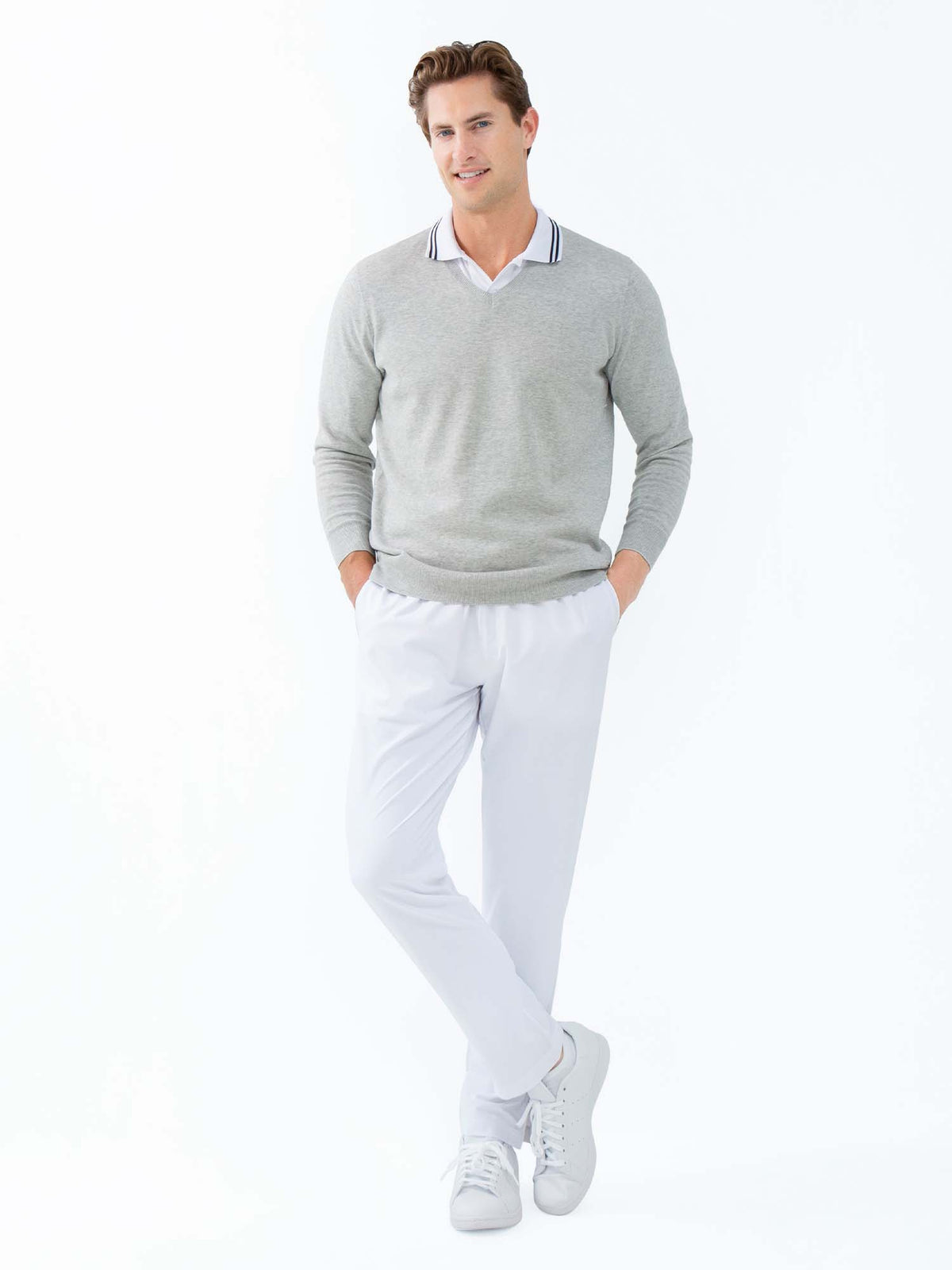 Men's white tennis pants by Hot Trend Vault with quick-dry fabric and zippered leg openings, designed for active performance.