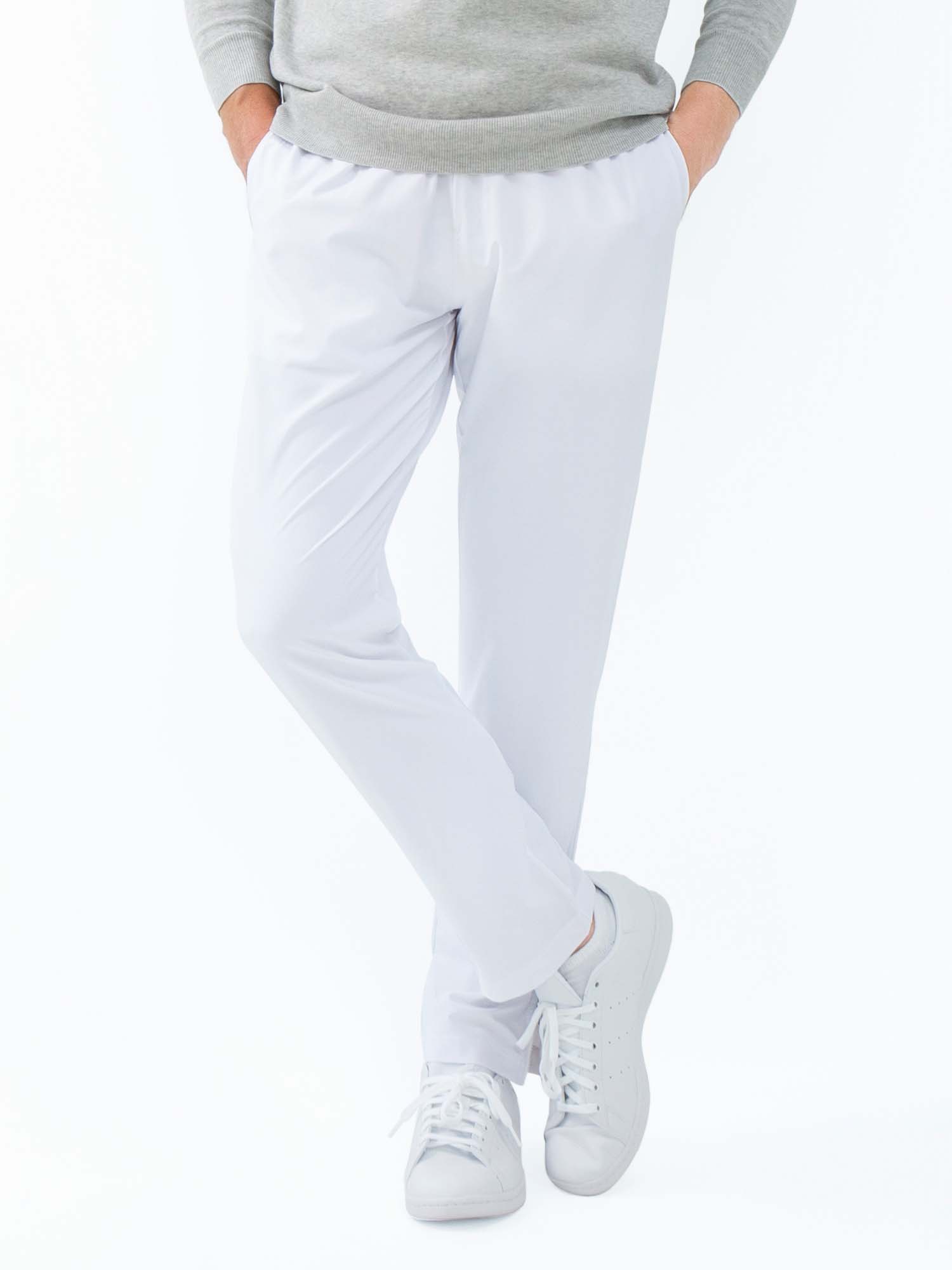 Men's white tennis pants by Hot Trend Vault with quick-dry fabric and zippered leg openings, designed for performance and comfort.