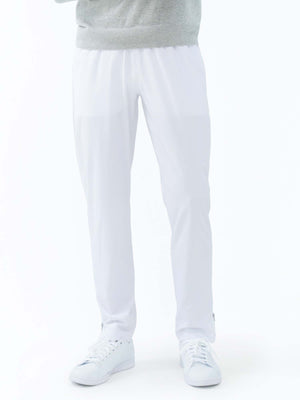 Men's white tennis pants by Hot Trend Vault featuring quick-dry fabric and zippered leg openings for performance and comfort.