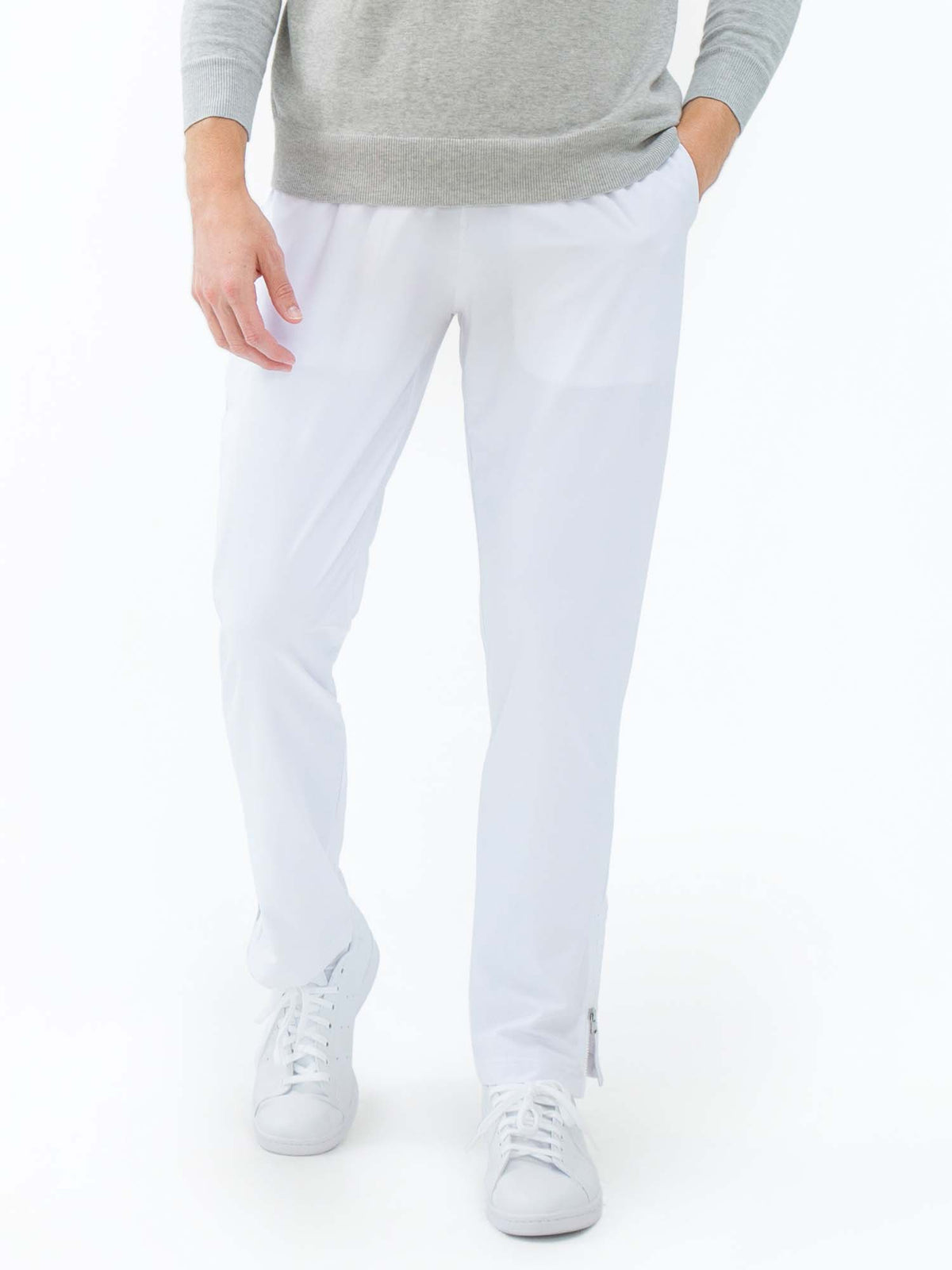 Men's white tennis pants by Hot Trend Vault with quick-dry fabric and zippered leg openings, designed for performance and comfort.