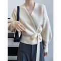Handmade French retro knitted women's cardigan sweater with V-neck and tie detail, loose fit, in soft yarn.