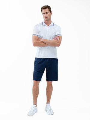 Men's white and midnight performance tennis polo with rib collar by Hot Trend Vault, classic fit, suitable for active sports and casual wear.